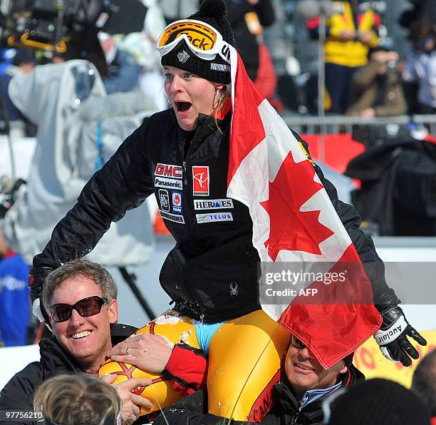 Canada's Emily Brydon celebrates her retirement from professional skiing in the finish area after the women's Alpine skiing World Cup Super G Slalom...