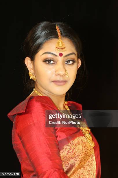 Indian model wearing an elegant designer saree during a South Indian bridal fashion show held in Scarborough, Ontario, Canada.