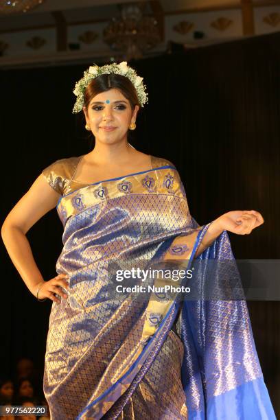 Indian model wearing an elegant and ornate Kanchipuram saree during a South Indian bridal fashion show held in Scarborough, Ontario, Canada.