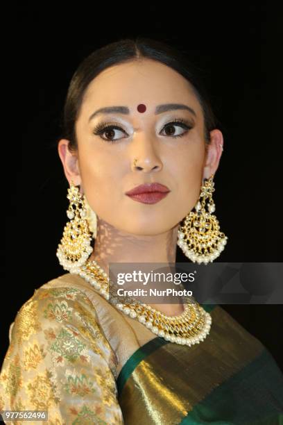 Indian model wearing an elegant and ornate Kanchipuram saree during a South Asian bridal fashion show held in Scarborough, Ontario, Canada.