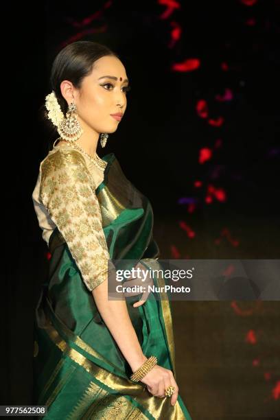 Indian model wearing an elegant and ornate Kanchipuram saree during a South Indian bridal fashion show held in Scarborough, Ontario, Canada.