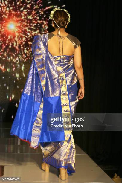 Indian model wearing an elegant and ornate Kanchipuram saree during a South Asian bridal fashion show held in Scarborough, Ontario, Canada.