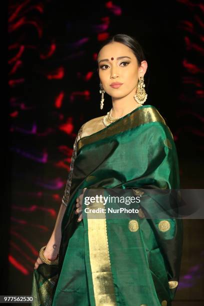 Indian model wearing an elegant and ornate Kanchipuram saree during a South Indian bridal fashion show held in Scarborough, Ontario, Canada.