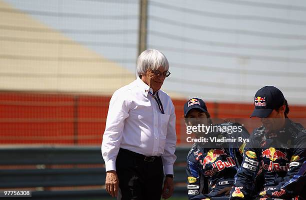 Supremo Bernie Ecclestone is seen with Mark Webber of Australia and Red Bull Racing and Sebastian Vettel of Germany and Red Bull Racing before the...