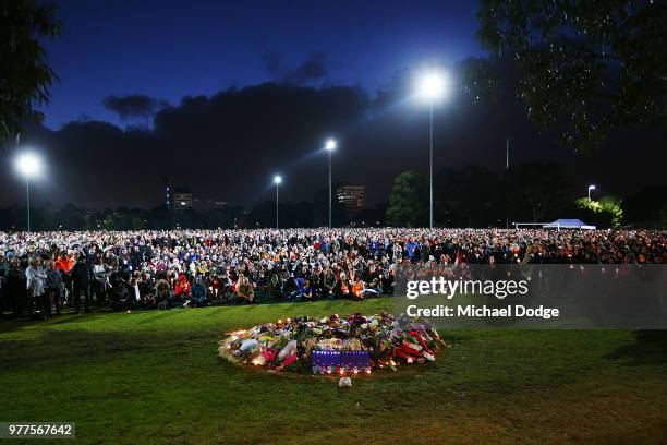 Mourners arrive to pay their respects during a vigil held in memory of murdered Melbourne comedian, 22-year-old Eurydice Dixon, at Princess Park on...