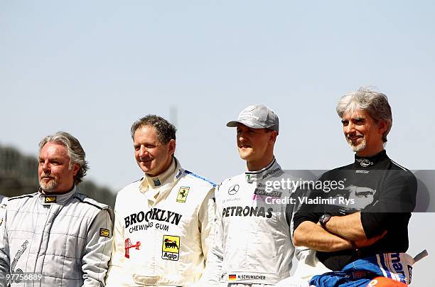 Former F1 World Champions Keke Rosberg, Jody Scheckter, Michael Schumacher and Damon Hill are seen before the Bahrain Formula One Grand Prix at the...