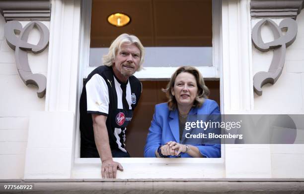 Richard Branson, the founder of Virgin Group Ltd., left, and Jayne-Anne Gadhia, chief executive officer of Virgin Money Holdings U.K. Ltd., look out...