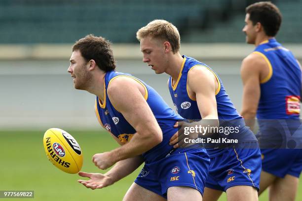 Jeremy McGovern and Oscar Allen work on a drill during a West Coast Eagles AFL training session at Subiaco Oval on June 18, 2018 in Perth, Australia.