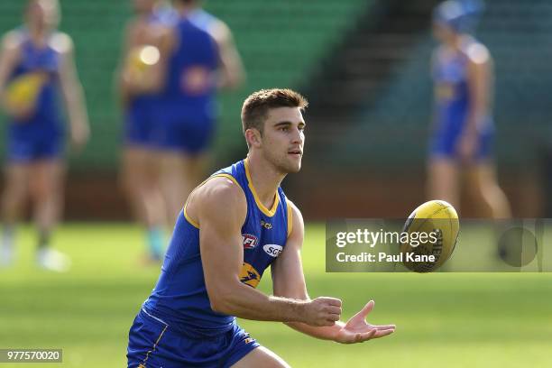 Elliot Yeo handballs during a West Coast Eagles AFL training session at Subiaco Oval on June 18, 2018 in Perth, Australia.