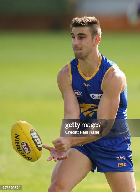 Elliot Yeo handballs during a West Coast Eagles AFL training session at Subiaco Oval on June 18, 2018 in Perth, Australia.