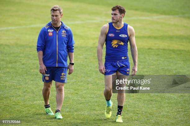 Assistant coach Sam Mitchell and Luke Shuey walk from the field during a West Coast Eagles AFL training session at Subiaco Oval on June 18, 2018 in...