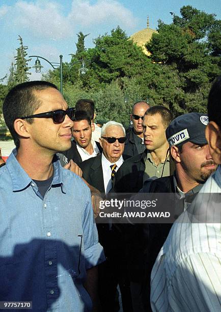 - File pictured dated 28 September 2000 shows right-wing opposition leader Ariel Sharon , flanked by security guards and his youngest son Gilad , as...