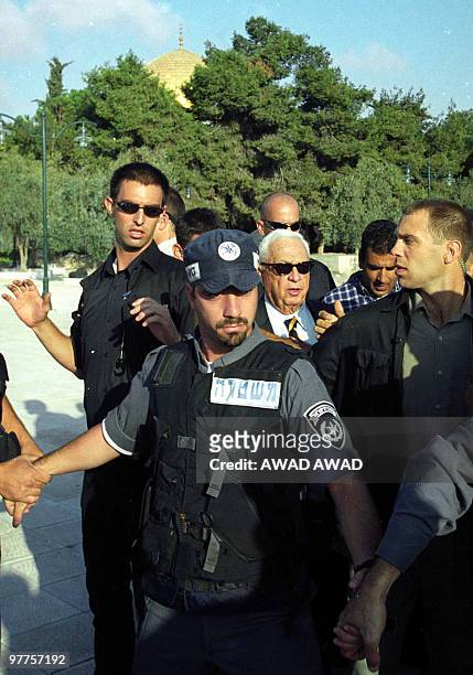 - File pictured dated 28 September 2000 shows right-wing opposition leader Ariel Sharon , flanked by security guards, as he visits the Al-Aqsa mosque...