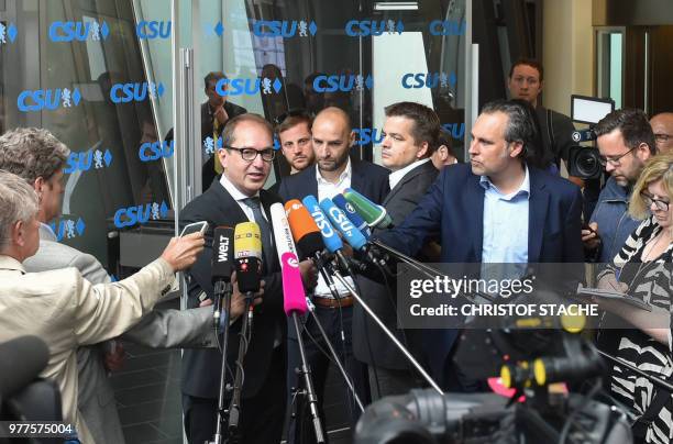 Parliamentary group leader of the Christian Social Union Party Alexander Dobrindt is surrounded by media as he arrives at the party headquarters in...