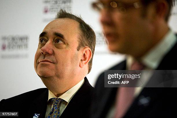 Scottish premier Alex Salmond looks on as Director of Marine Estate Rob Hastings addresses a press conference in Edinburgh, on March 16, 2010 to...