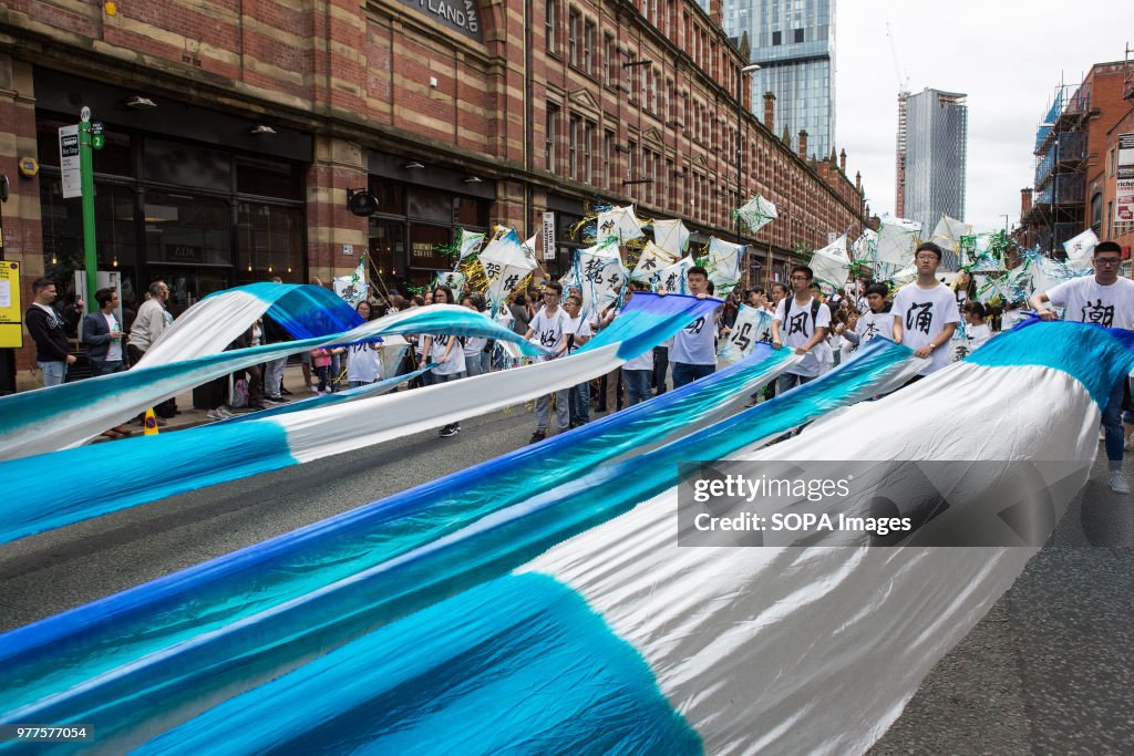 Participants holding long banners during the Manchester day...