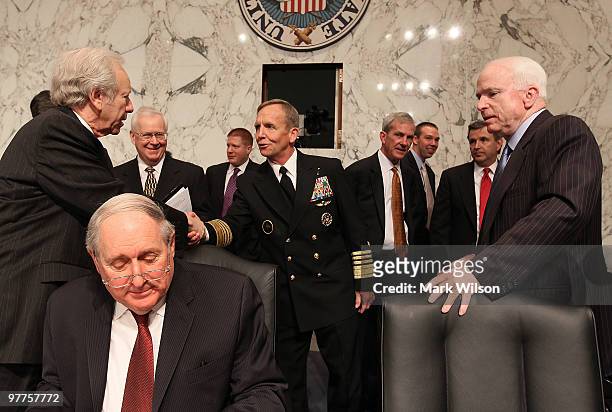 Navy Adm. Eric Olson , commander of the U.S. Special Operations Command greets Sen. Joe Lieberman while Sen. John McCain and Sen. Carl Levin stand...