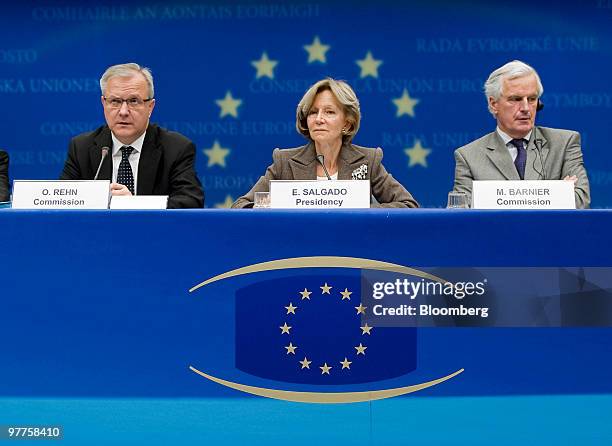 Olli Rehn, European Union economic and monetary affairs commissioner, left, speaks as Elena Salgado, Spain's finance minister, center, and Michel...