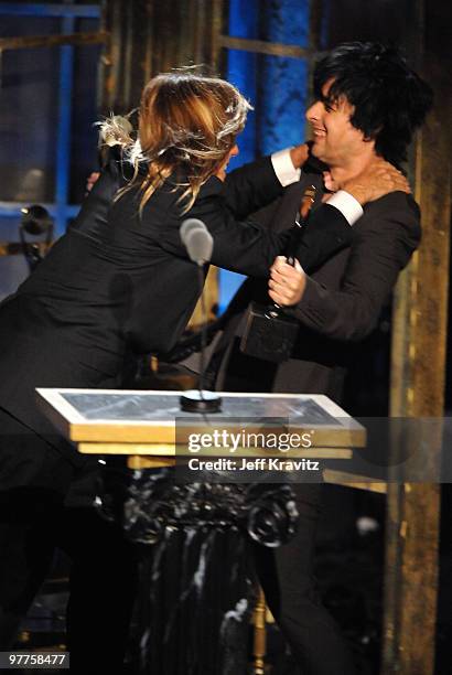 Inductee Iggy Pop of Iggy & the Stooges and musician Billie Joe Armstrong speak onstage at the 25th Annual Rock and Roll Hall of Fame Induction...