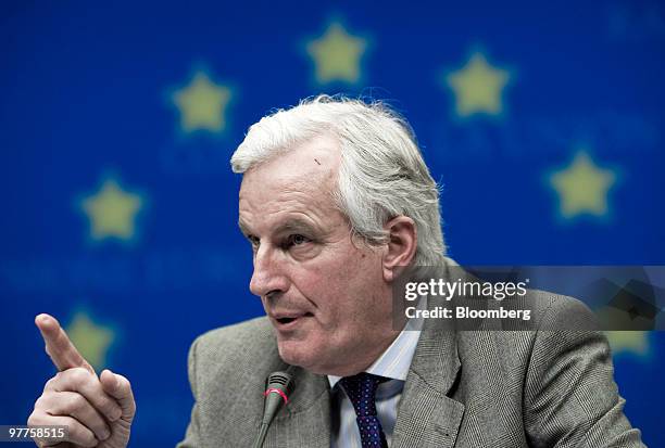 Michel Barnier, European Union internal market commissioner, gestures during the news conference following the meeting of European Union finance...