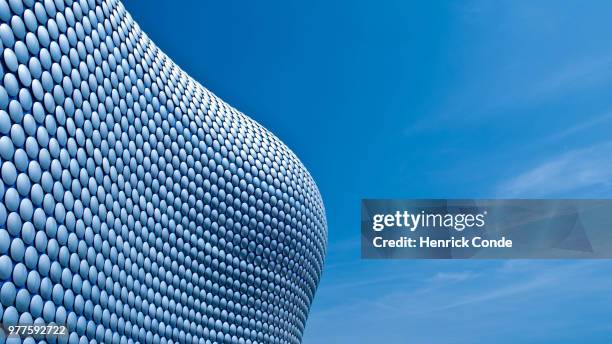 close-up of modern building against blue sky, birmingham, usa - birmingham england stock-fotos und bilder