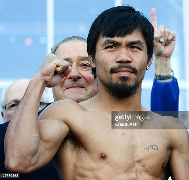 Welterweight boxers Manny Pacquiao of the Philippines poses for the press during his weigh-in with Joshua Clottey of Ghana at the Dallas Cowboys...