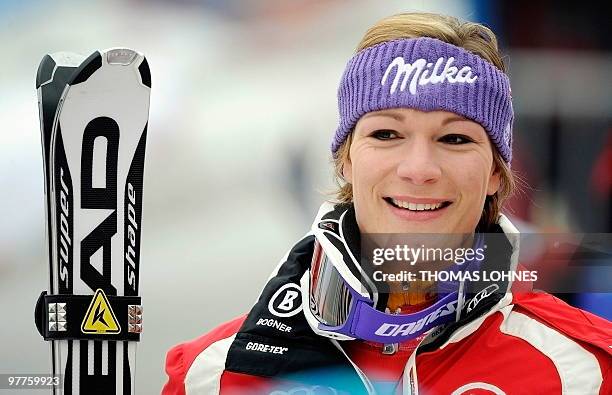 Germany's Maria Riesch pose for a photo after the first run in the women's Alpine skiing World Cup Slalom finals in Garmisch Partenkirchen, southern...