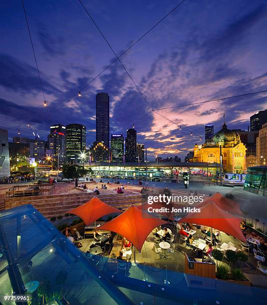 federation square and skyline. - federation square melbourne stock-fotos und bilder