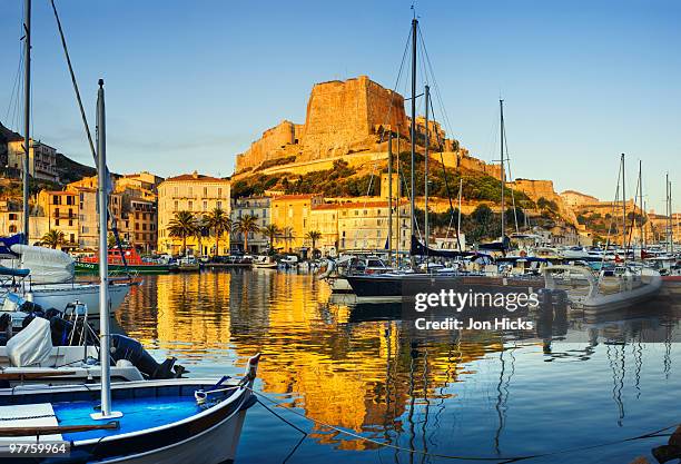 view of the citadel across the marina. - bonifacio stock pictures, royalty-free photos & images