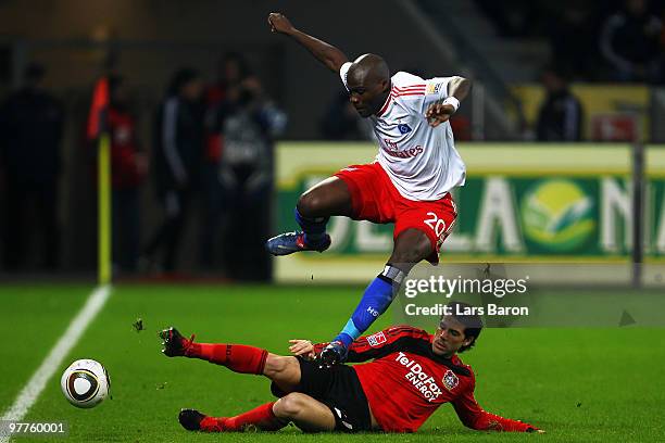 Guy Demel of Hamburg is challenged by Gonzalo Castro of Leverkusen during the Bundesliga match between Bayer Leverkusen and Hamburger SV at BayArena...