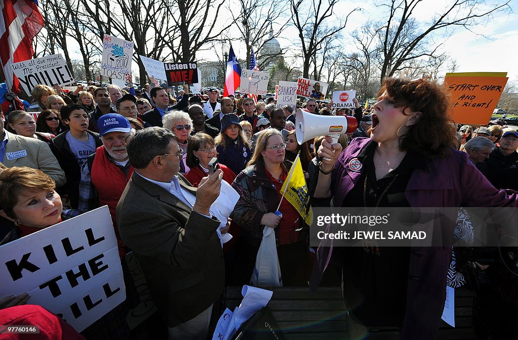 Participants display placards during a d