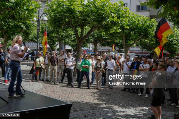 Heidi Mund addresses the rally. Around 50 right-wing protesters followed the call of Heidi Mund, the former organiser of the FRAGIDA protest in...