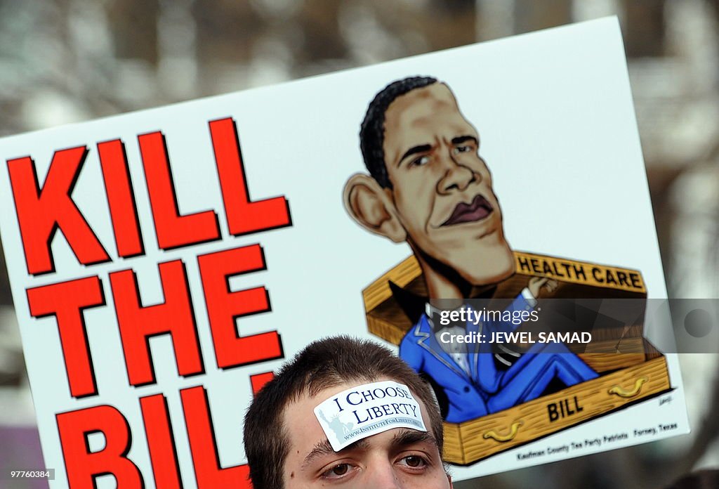 Participants display placards during a d
