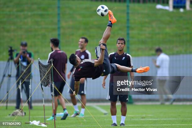 Marco Fabian of Mexico kicks the ball during a training session & Press conference at Training Base Novogorsk-Dynamo, on June 18, 2018 in Moscow,...