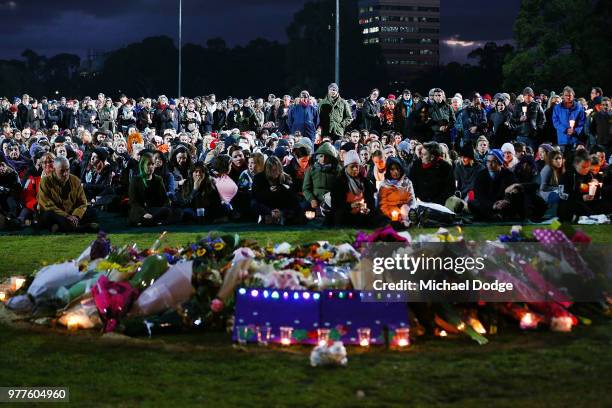 Mourners pay their respects during a vigil held in memory of murdered Melbourne comedian, 22-year-old Eurydice Dixon, at Princess Park on June 18,...