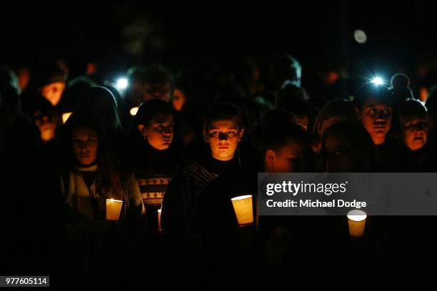 Mourners pay their respects during a vigil held in memory of murdered Melbourne comedian, 22-year-old Eurydice Dixon, at Princess Park on June 18,...