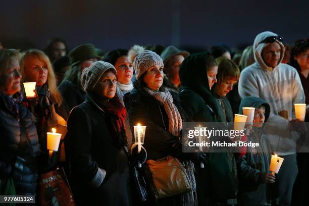 Mourners pay their respects during a vigil held in memory of murdered Melbourne comedian, 22-year-old Eurydice Dixon, at Princess Park on June 18,...