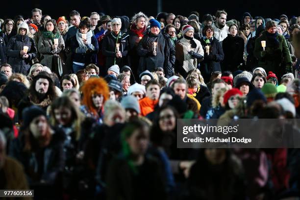 Mourners pay their respects during a vigil held in memory of murdered Melbourne comedian, 22-year-old Eurydice Dixon, at Princess Park on June 18,...