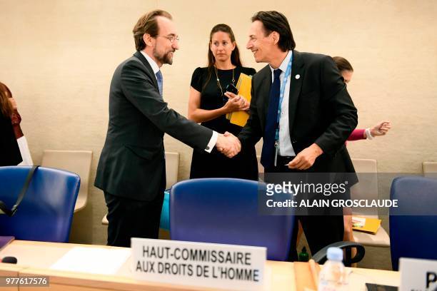United Nations High Commissioner for Human Rights Zeid Ra'ad Al Hussein shakes hands with president of the Human Rights Council Vojislav Suc, during...