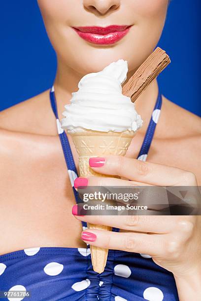 young woman with ice cream cone - woman ice cream stock pictures, royalty-free photos & images