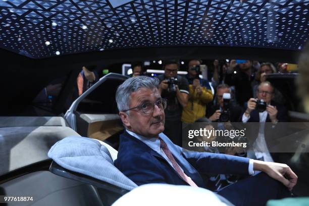 Rupert Stadler, chief executive officer of Audi AG, sits for a photograph inside an Audi Aicon electric automobile during the Volkswagen AG media...