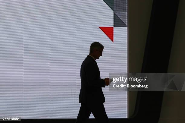 The silhouette of Rupert Stadler, chief executive officer at Audi AG, is seen on stage during an opening ceremony for the company's new production...