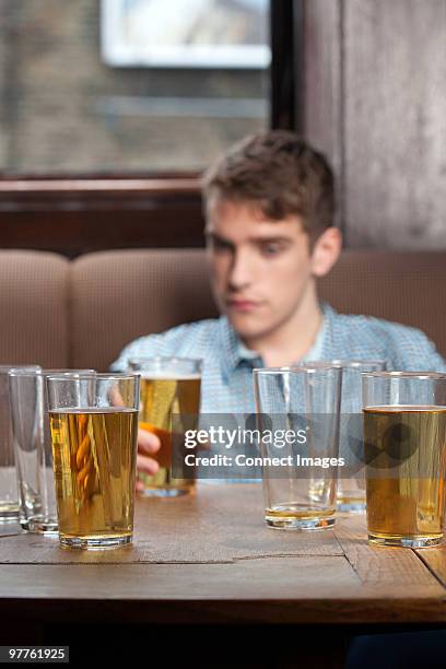 young man in bar - lewisham stock pictures, royalty-free photos & images