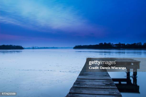 jetty on dutch lake, groningen, holland - groningen province stock pictures, royalty-free photos & images