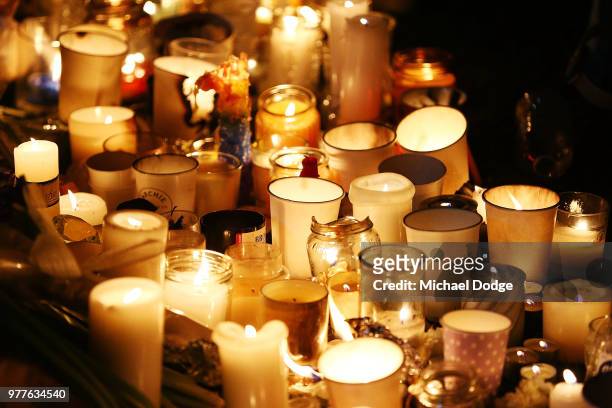 Candles are seen during a vigil held in memory of murdered Melbourne comedian, 22-year-old Eurydice Dixon, at Princess Park on June 18, 2018 in...