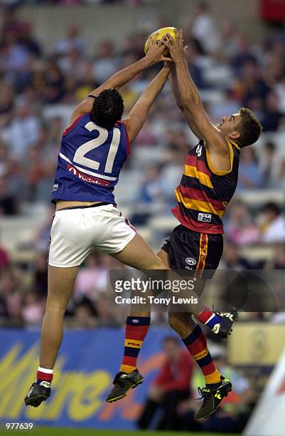 Patrick Wiggins for the Bulldogs and Andrew Crowell for Adelaide contest a mark in the match between the Adelaide Crows and the Western Bulldogs...