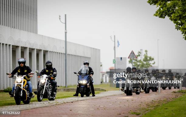 Members of Satudarah ride their bikes outside the Dutch court in Badhoevedorp, on June 18, 2018 as Dutch judges banned a national motorcycle club and...