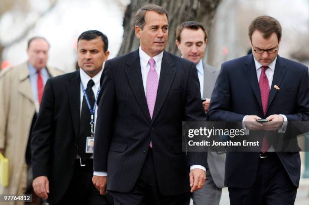House Minority Leader Rep. John Boehner arrives with staff members for a news conference to unveil a new GOP television ad against President Barack...