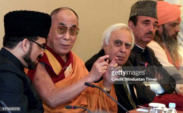 Indian Science and Technology Minister Kapil Sibal, Jammu and Kashmir Chief Minister Ghulam Nabi Azad look on as Tibetan spiritual leader Dalai Lama...