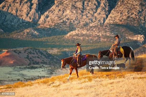 horseback riders - wyoming stock pictures, royalty-free photos & images